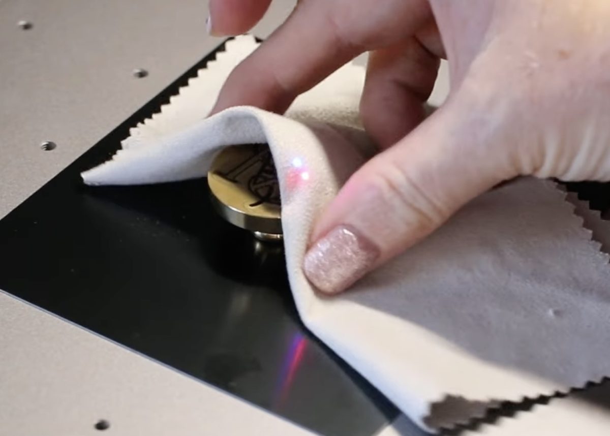 Remove the custom wax seal stamp from the laser.