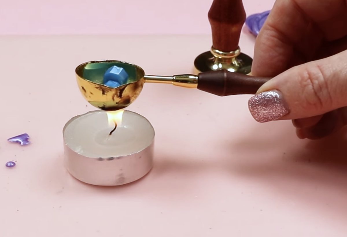 Melt wax cubes over a candle.