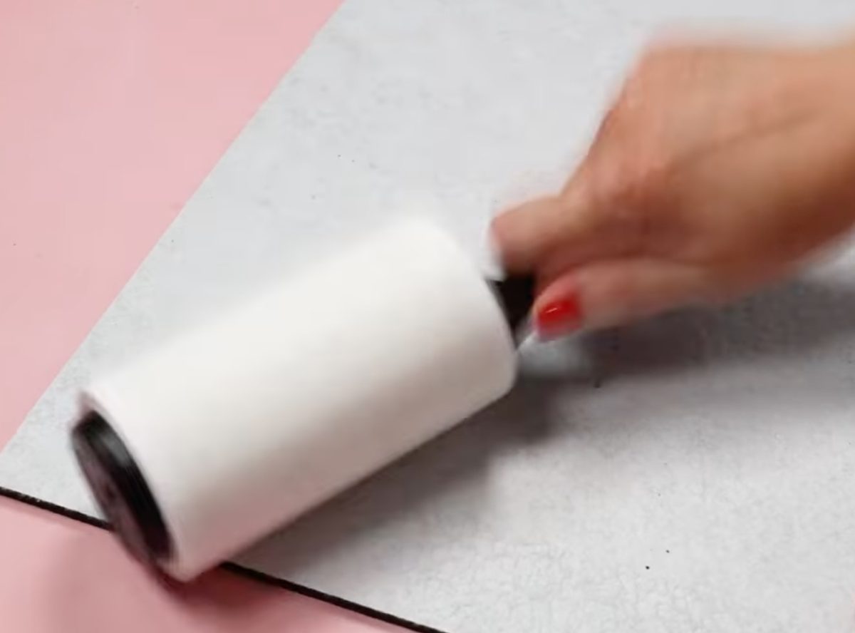 Lint roll the mat to remove hair, dust, and other debris.