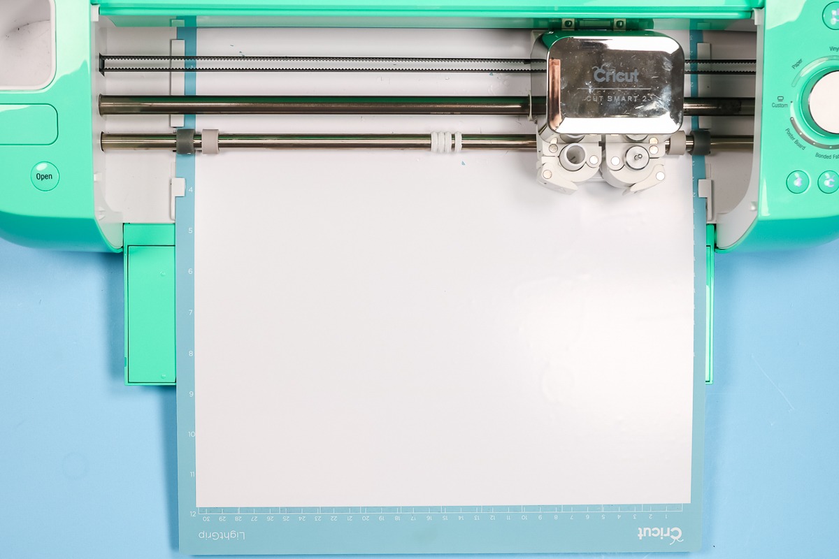 White HTV loaded in Cricut Explore.