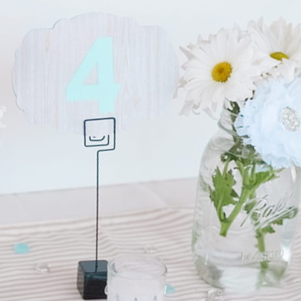 table numbers with flowers in jars