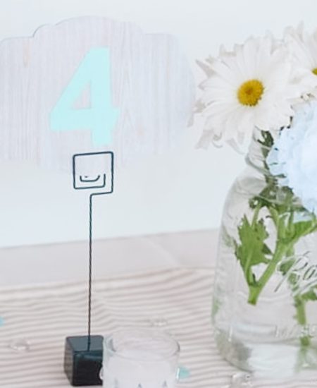 table numbers with flowers in jars