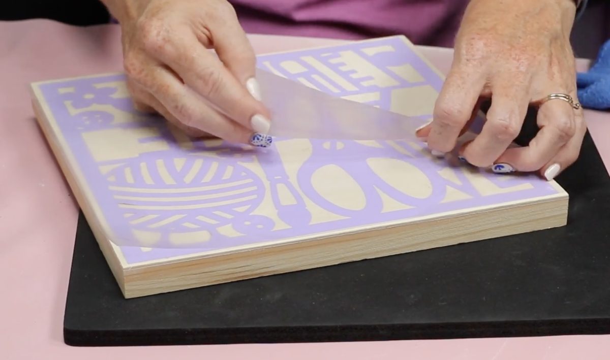 Carefully peel back the carrier sheet.