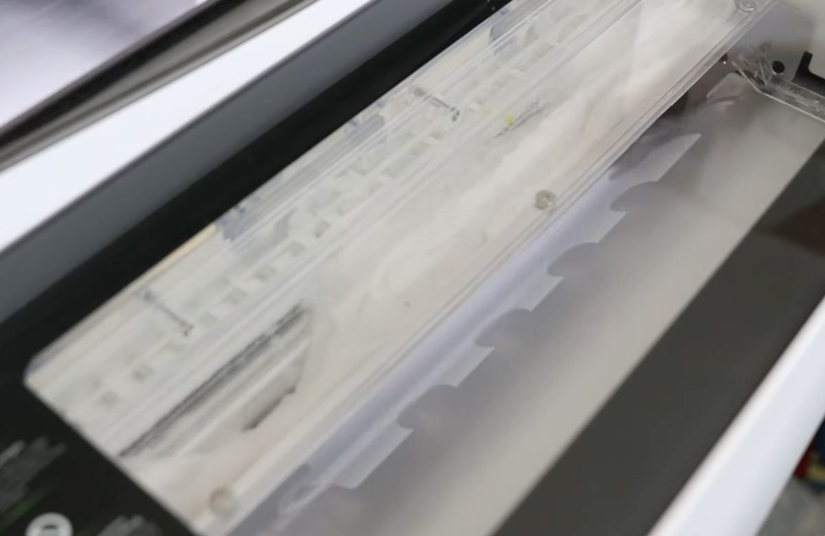 Adhesive being applied with the automatic shaker.