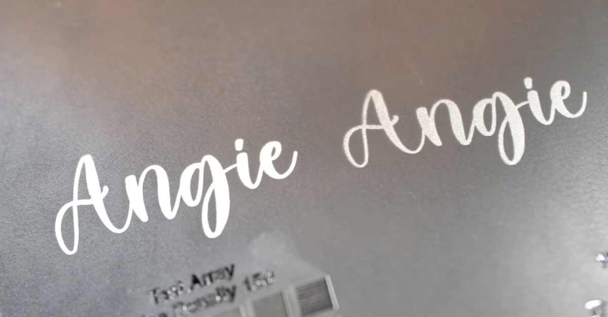 Laser engraved name on faux leather.