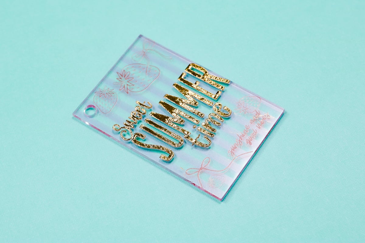Finished clear acrylic with gold foil.