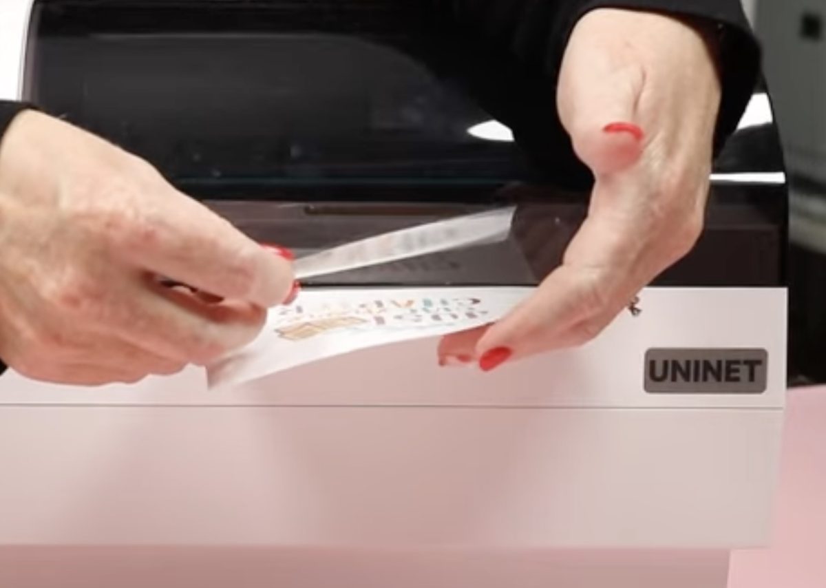 Add laminate material to the printed sticker while it's still in the iColor 250.