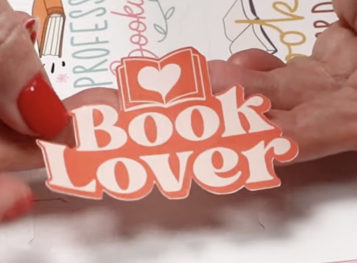 Detailed book lover sticker cut lower on the page.