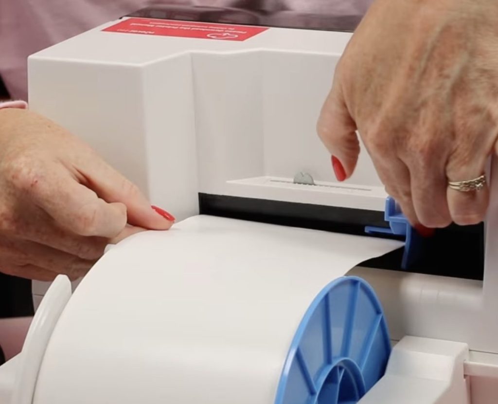 Load the media into the back of the iColor 250 printer.