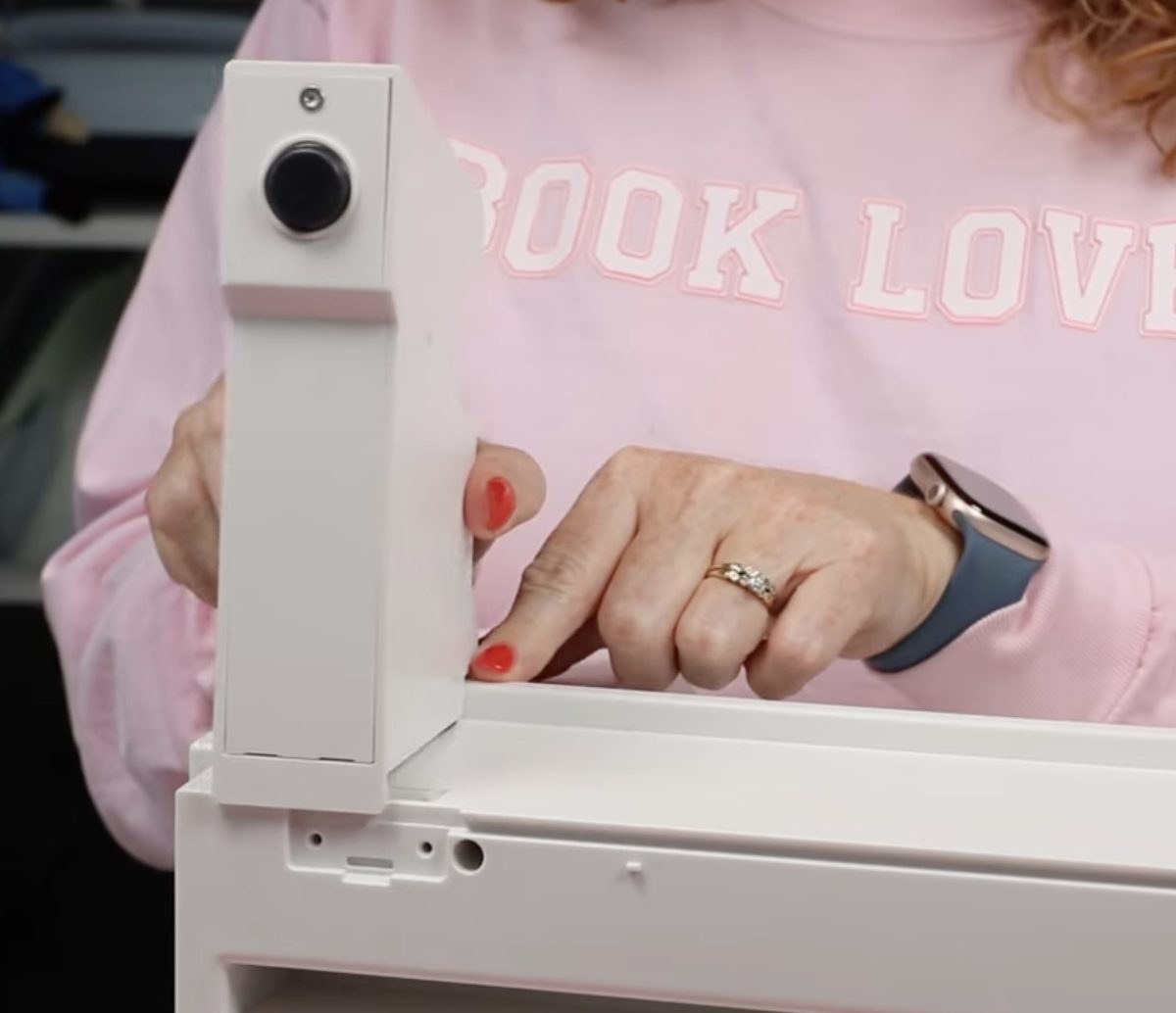 Slide media holder piece onto printer.