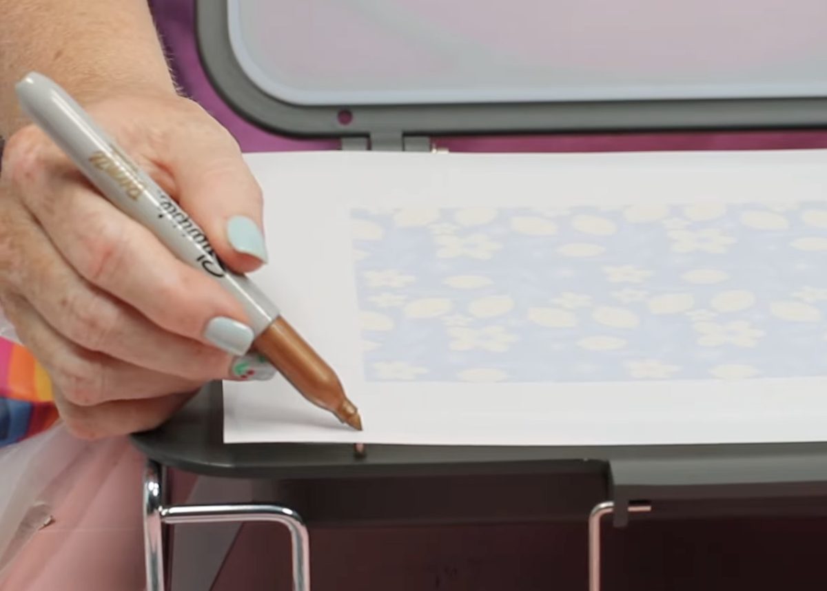 Mark where to hole punch the film.