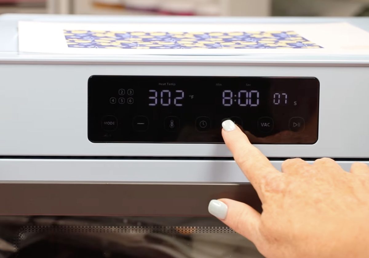 Place film print on top of oven while it preheats.