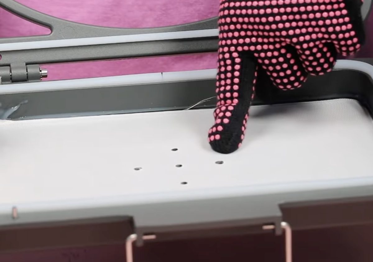 Close up of holes in the vacuum tray.