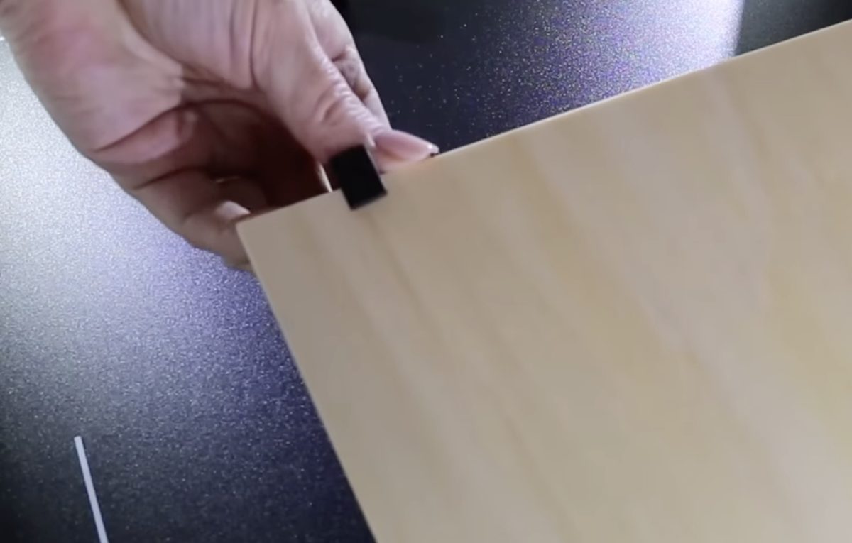 Magnetic clips attach to the material.
