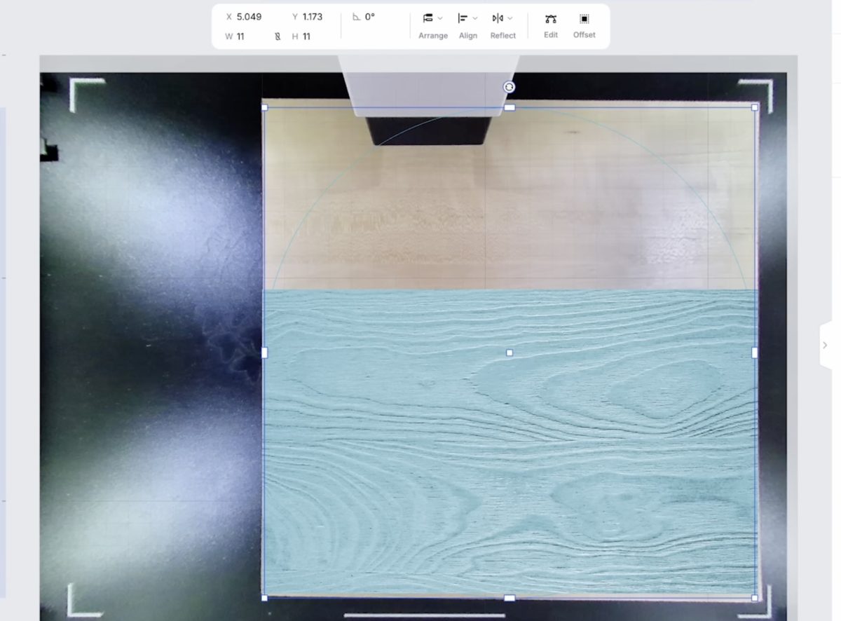 Lay the wood in the laser to print.