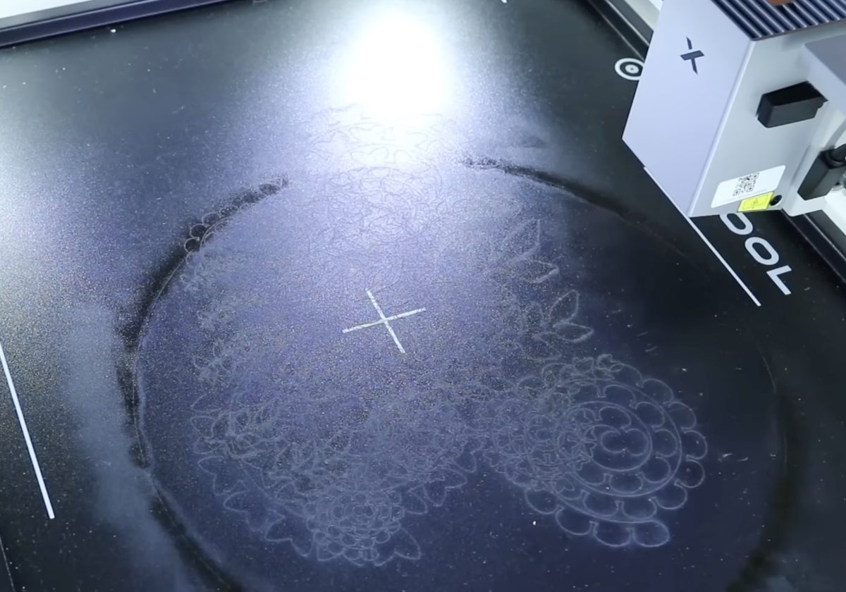 Laser marks in the bed of the xTool M2 laser.