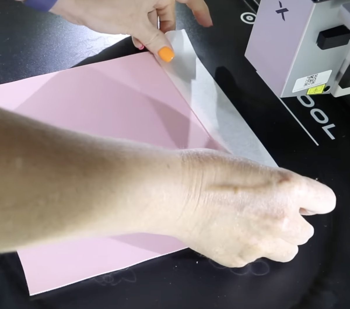 Add faux leather to the laser with masking tape.