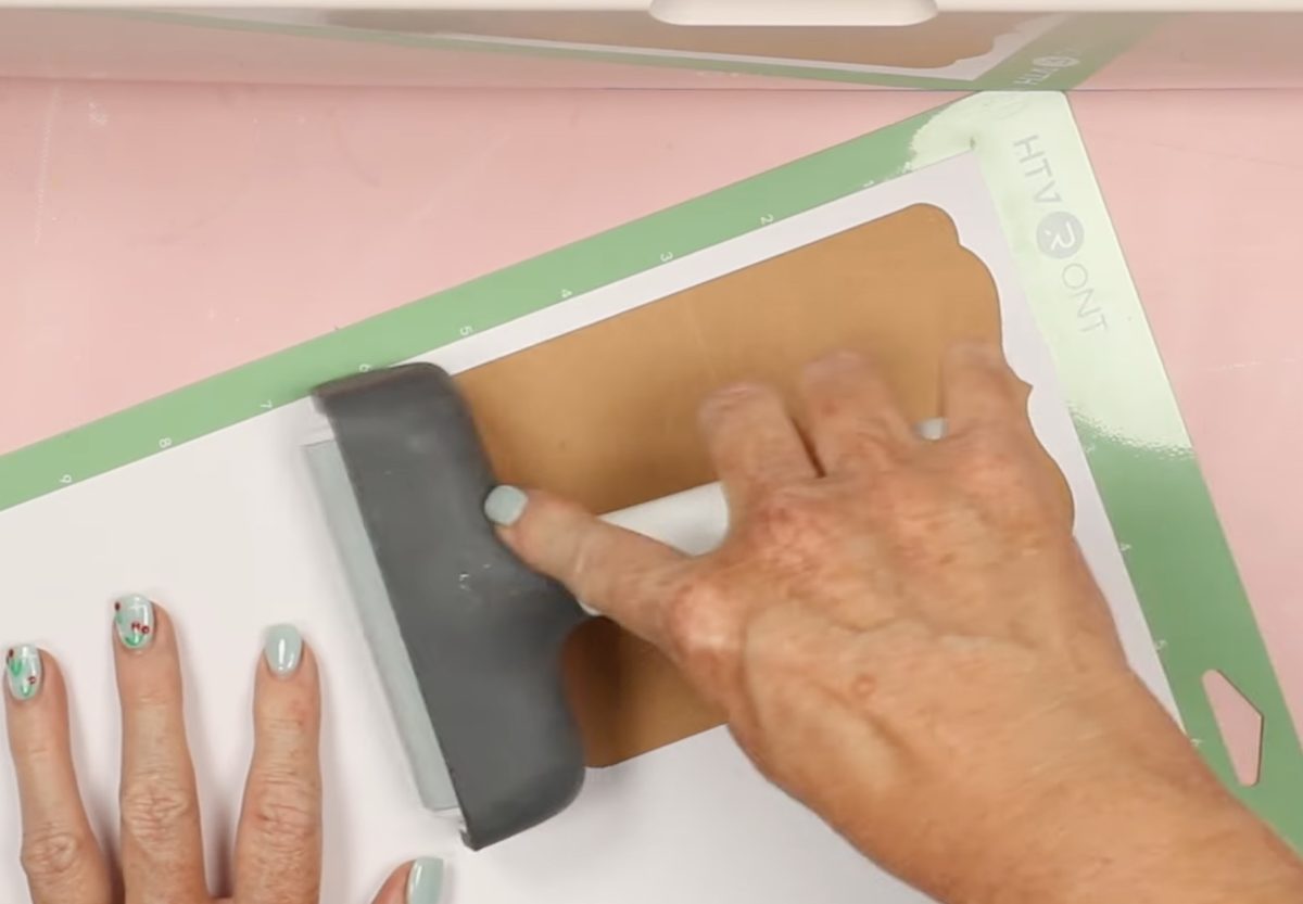 Use the brayer to press it onto the mat well.