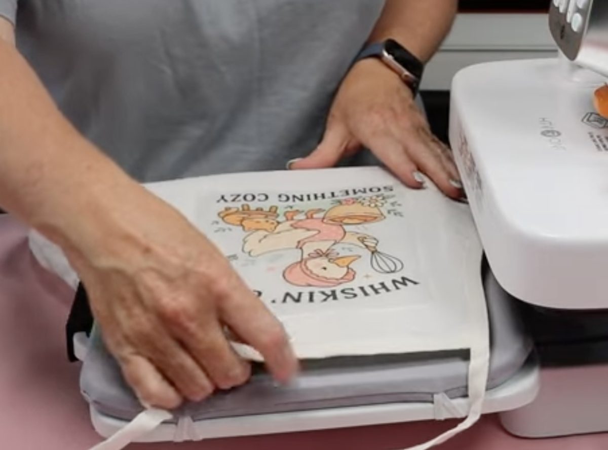 Locate DTF design on child's apron.