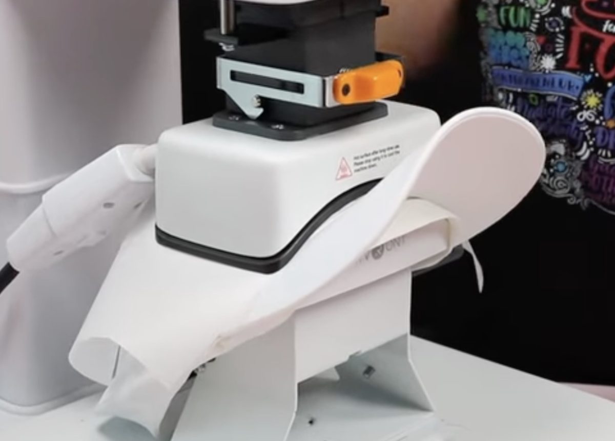 Cover the HTV with protective paper and press again.