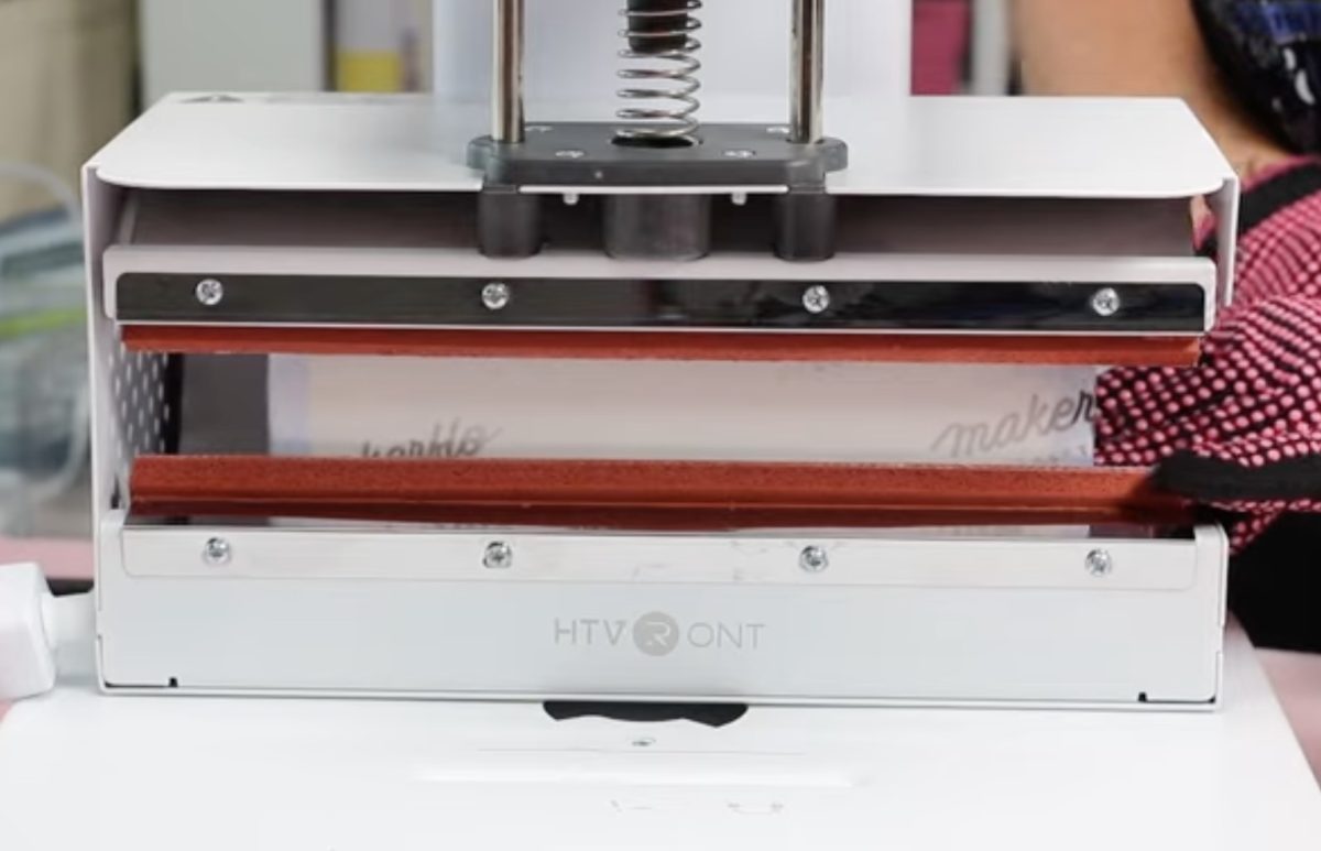 Slide sublimation tumbler into the HTVRont A100.