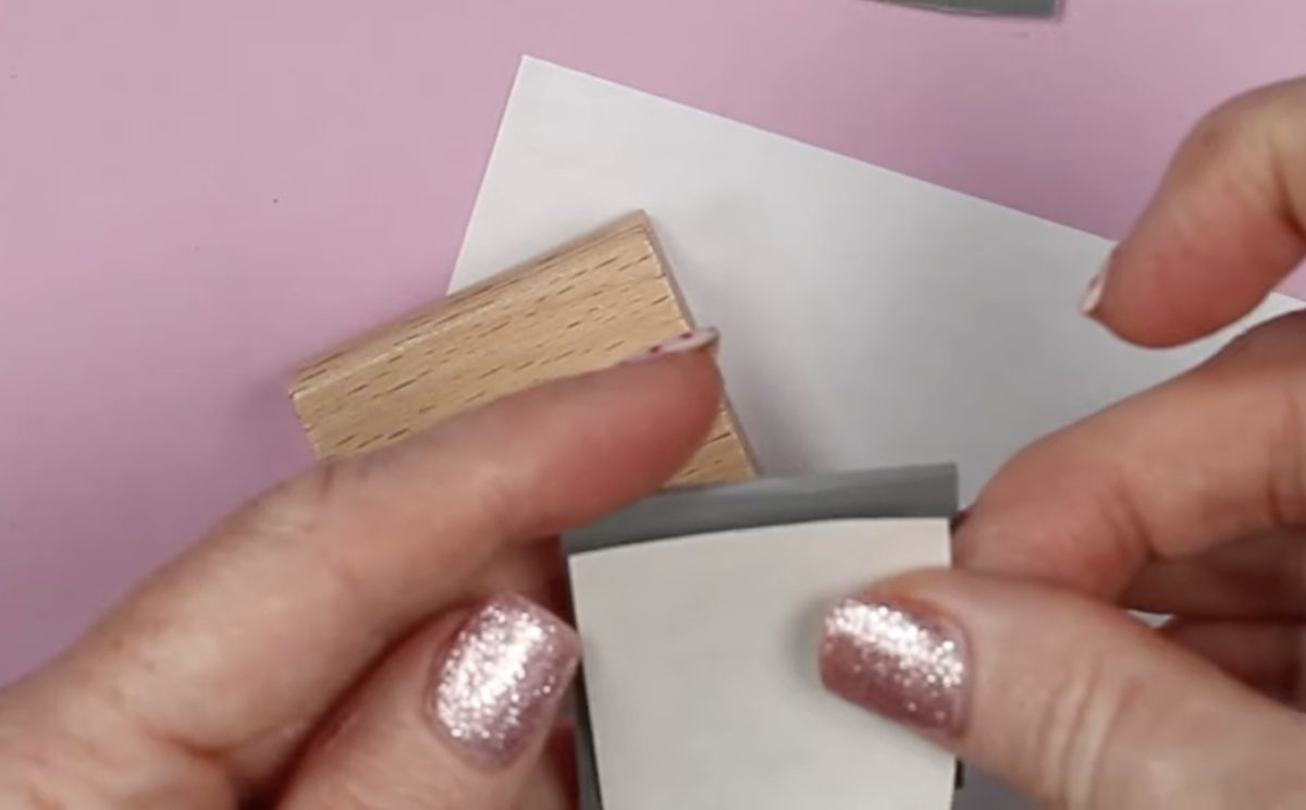 Add adhesive sheet to rubber stamp.