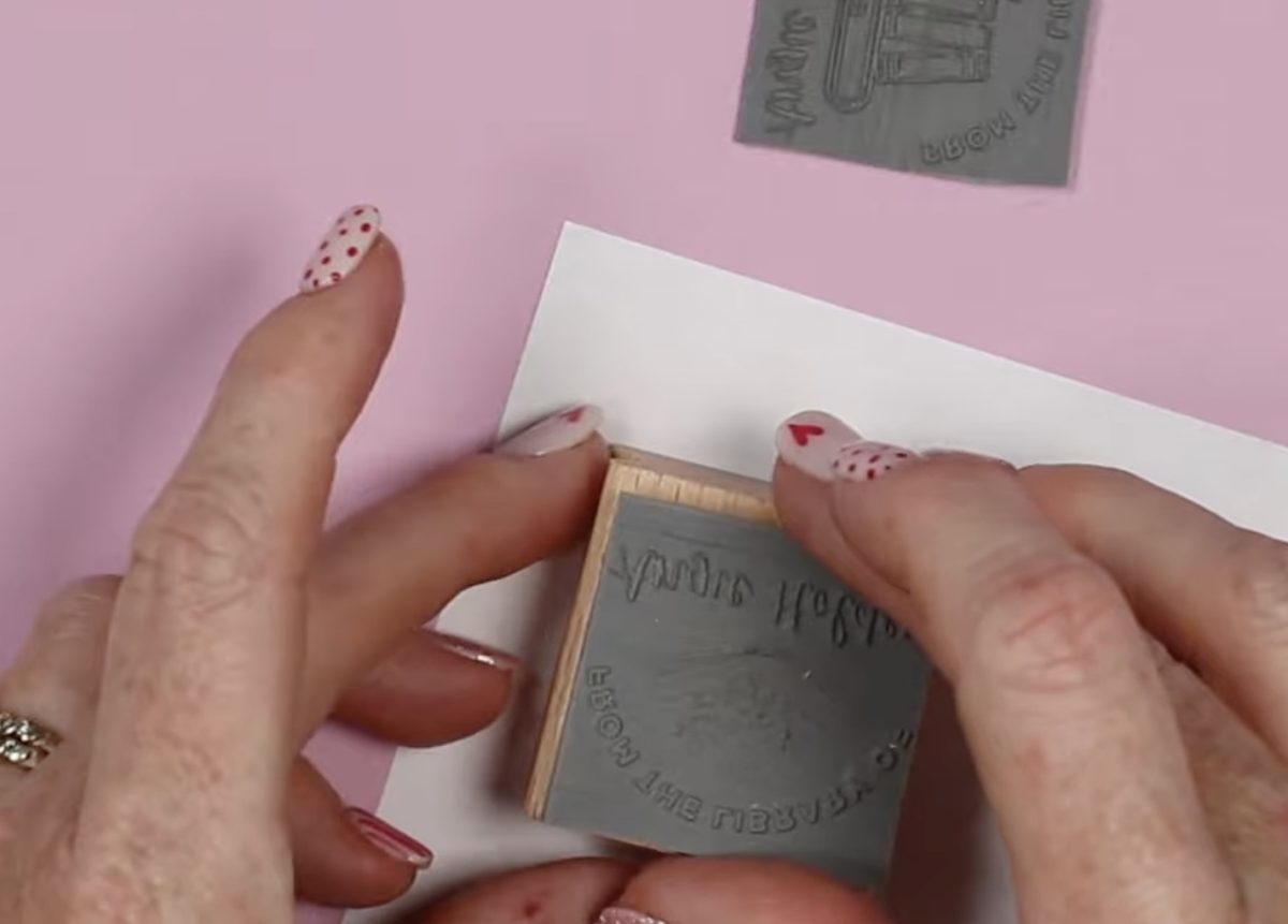 Locate engraved rubber on wood block.