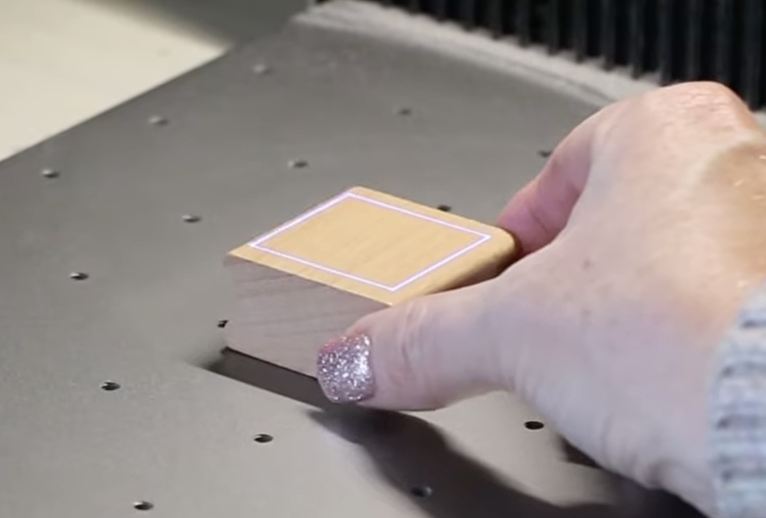 Frame laser on wood block.
