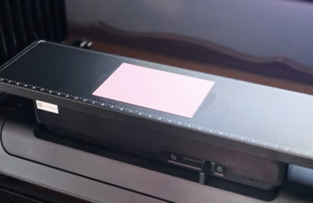 Add paper to the printer bed.