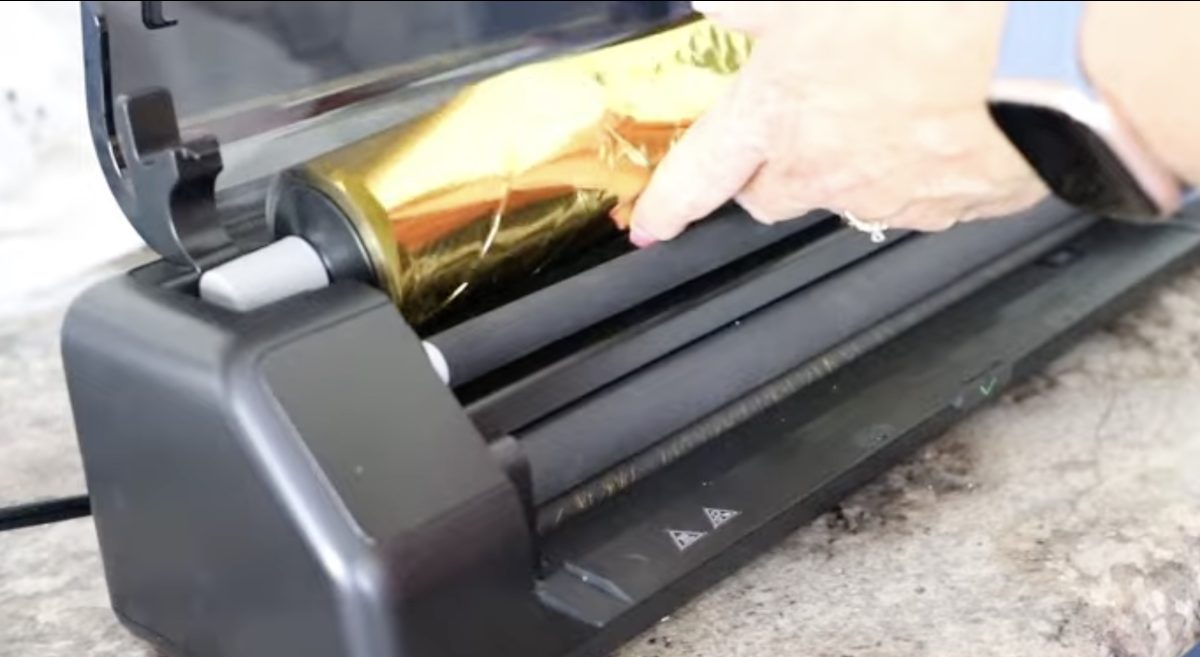 Place the foil in the laminator.