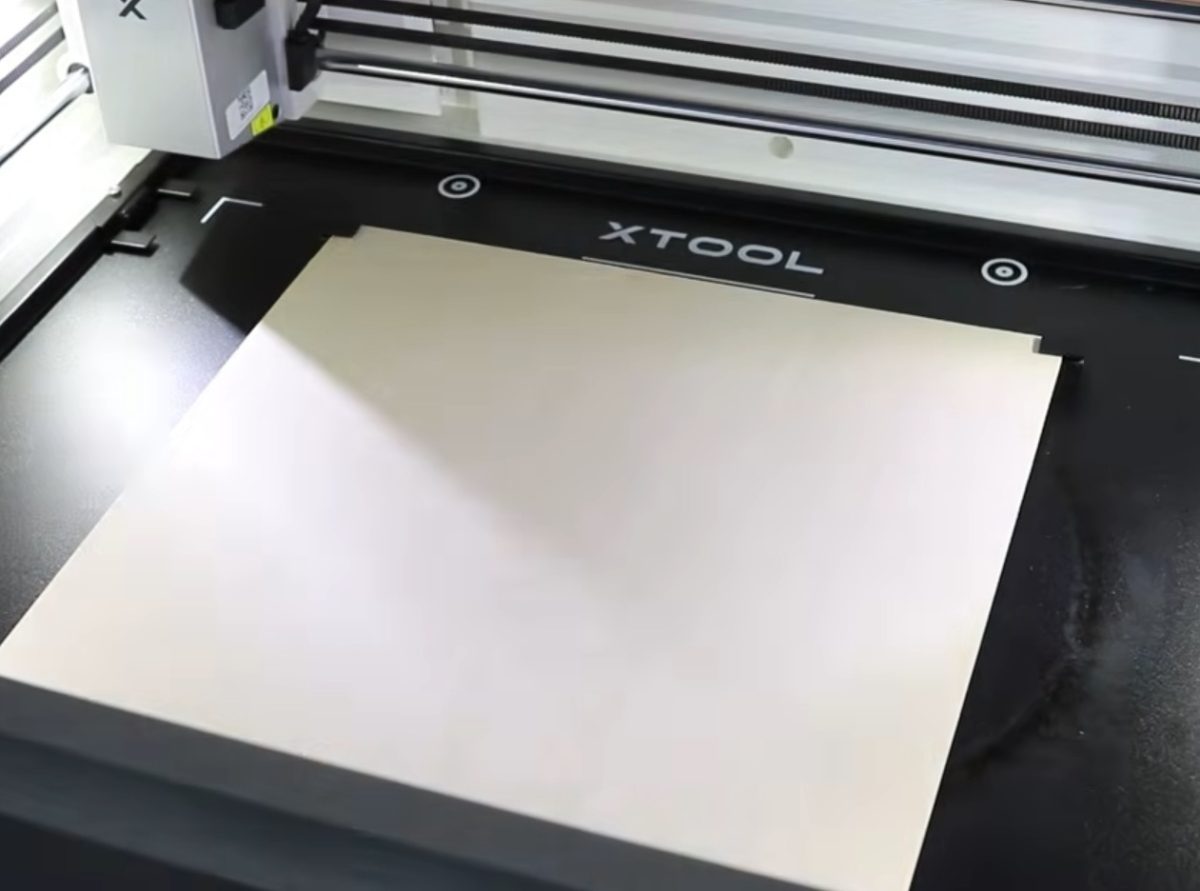 Add wood to laser bed.