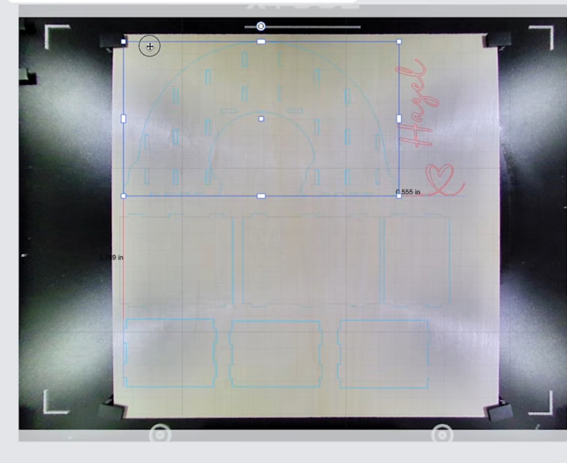 Move designs onto the wood piece in the software.