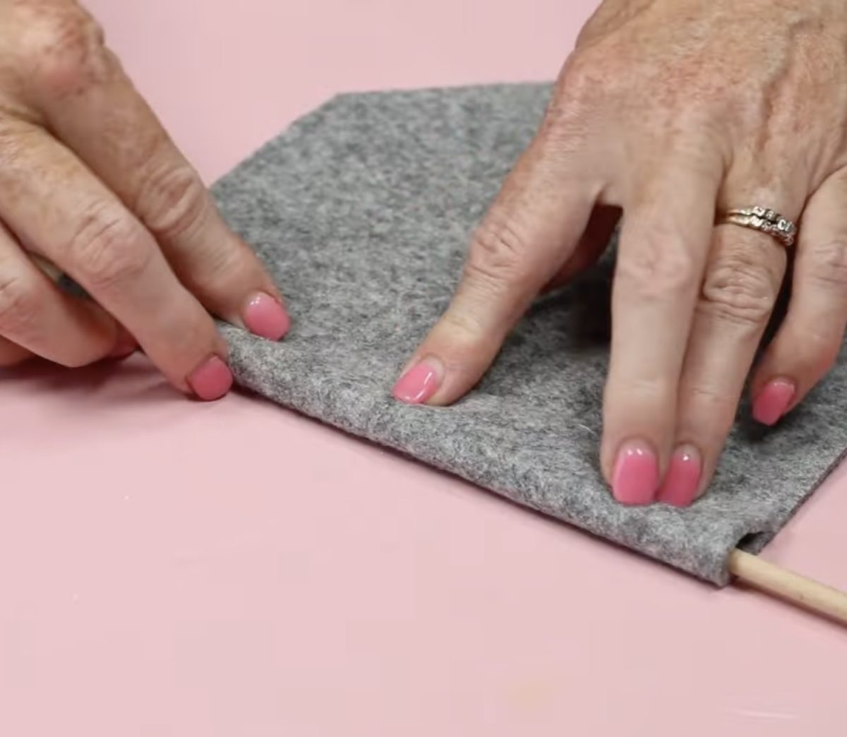 Fold felt over dowel.