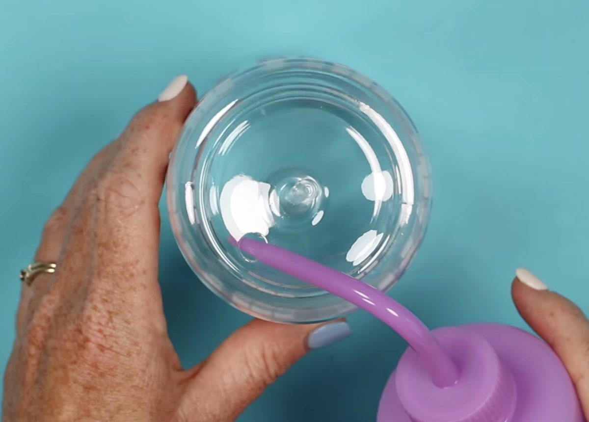 Add solution to the tumbler.