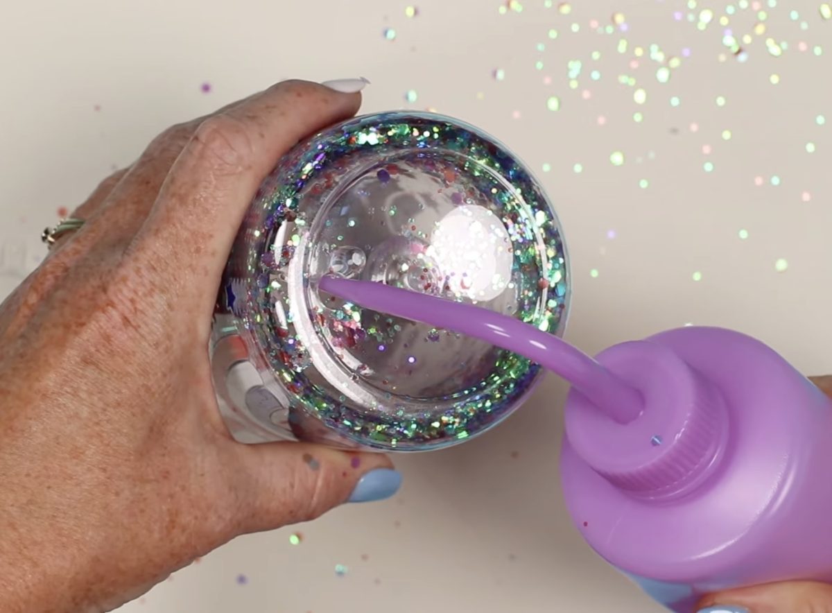 Tip the tumbler to add more solution.