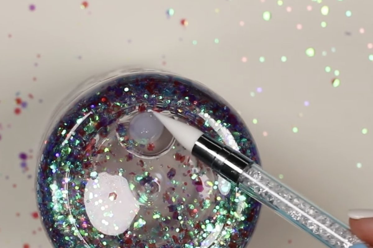 Use a silicone tool to spread the resin on the plug.