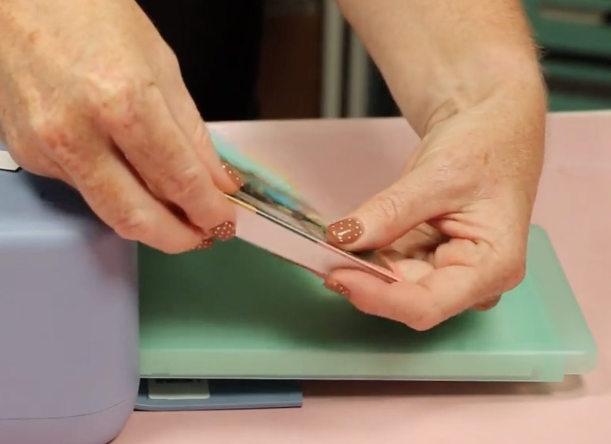 Snap off the perforated edge.