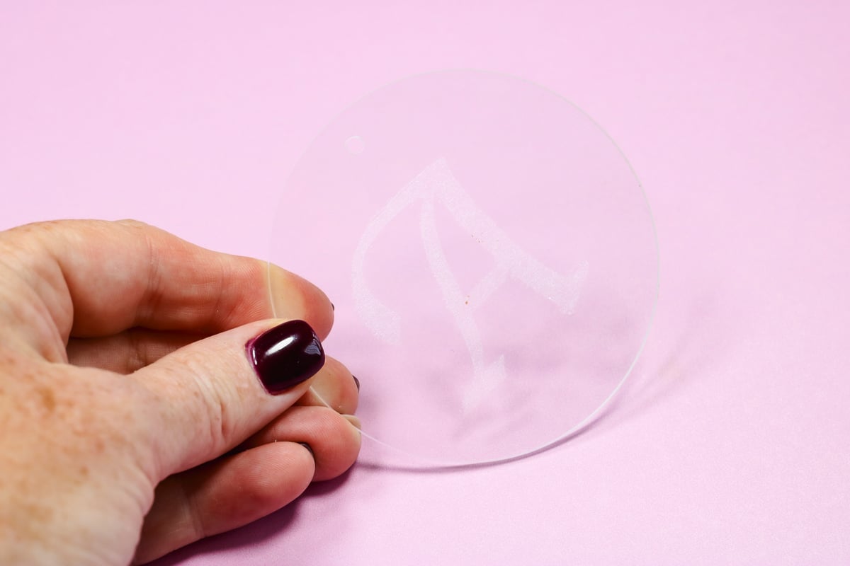 Finished, engraved clear acrylic ornament.