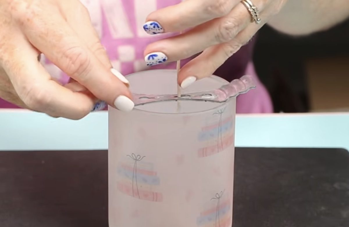 Place the wick in the candle and secure with the wick holder.