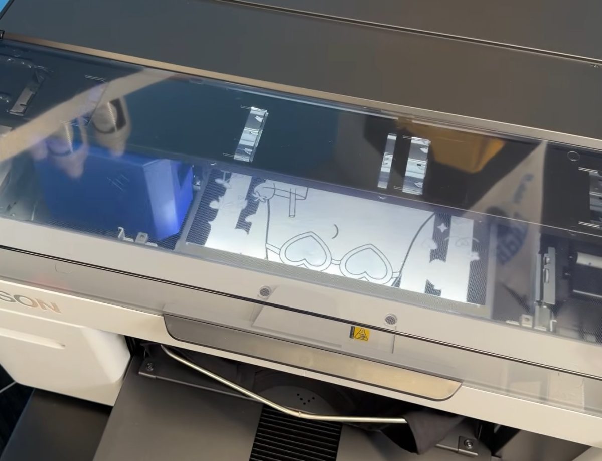 DTG printer, printing white ink first.
