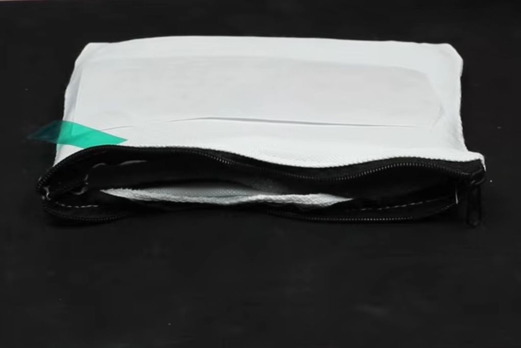 Sublimation zipper pouch with design located.