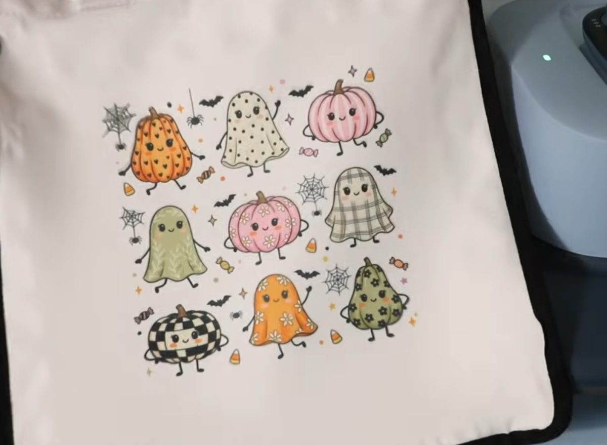 Sublimation tote bag with a smaller sublimation design pressed on it.