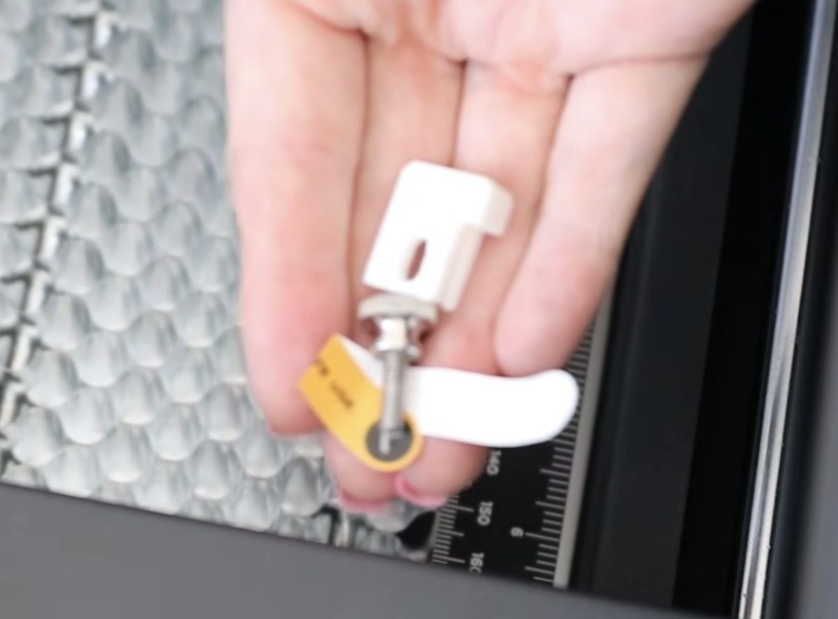 Screws to remove from the laser bed before use.