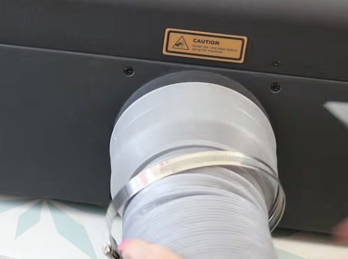 Vent hose attached to back of FLUX beamo II.