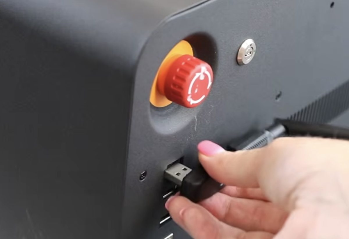 Wi-Fi dongle and emergency stop on back of beamo II.