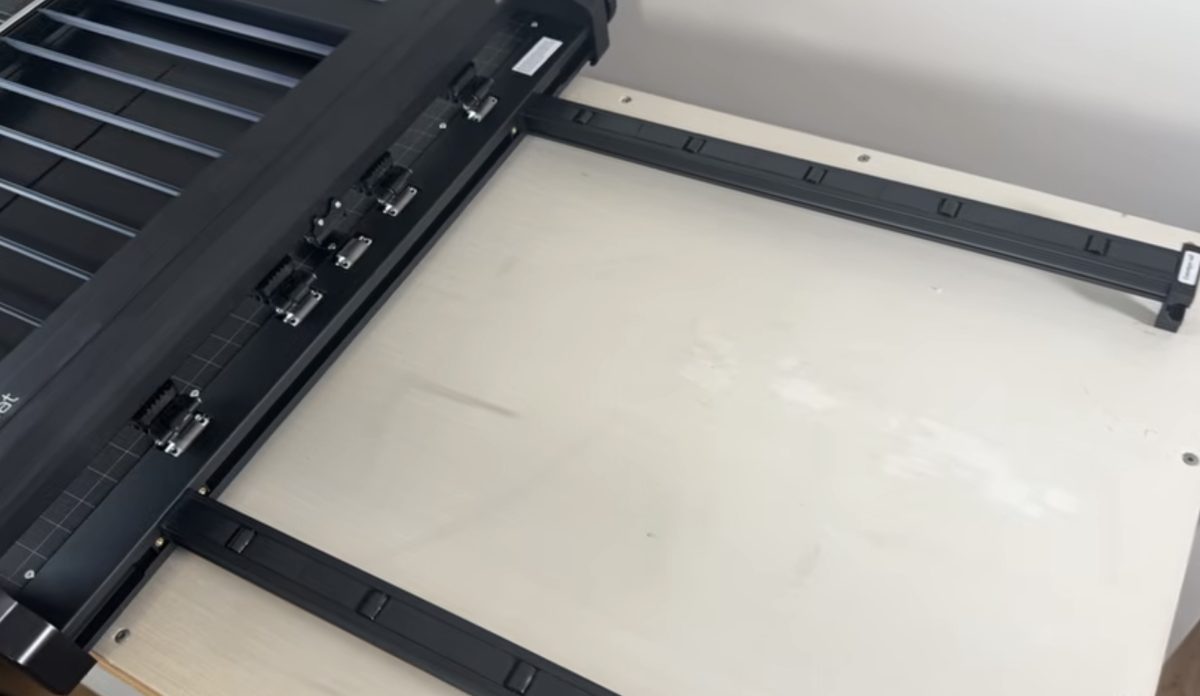 Add the conveyor rails to the frame.