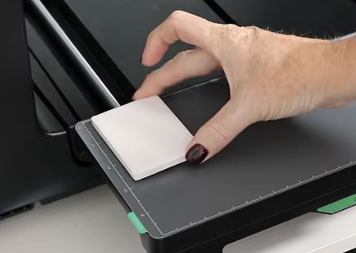 Add the ceramic magnet to the sticky mat.