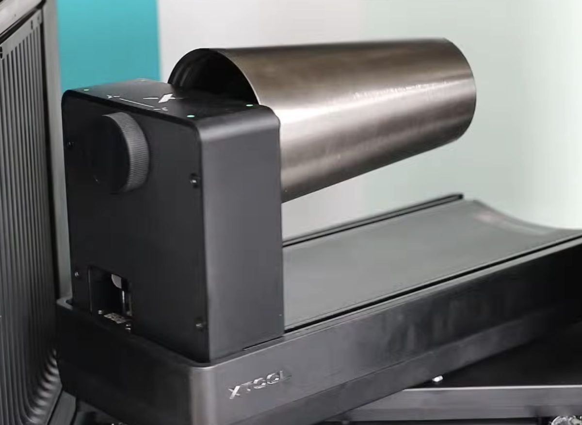 Rotary attachment scanning a tumbler.