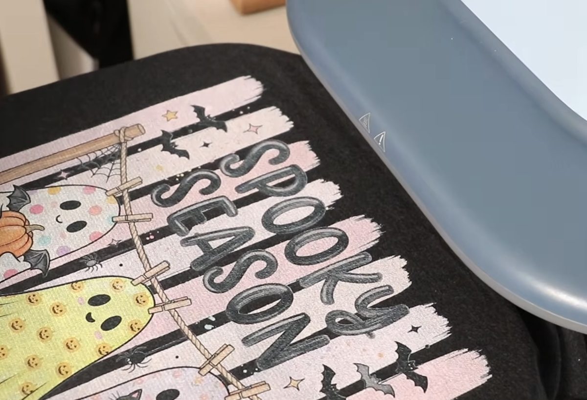Place DTG shirt on a heat press.